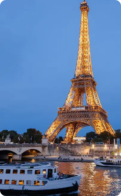 The Eiffel Tower lit at dusk